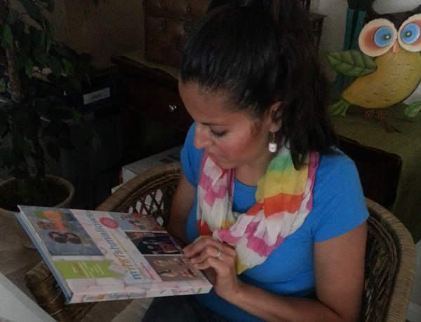 Alejandra looking at book