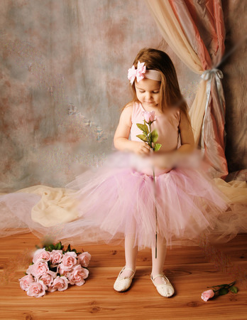 Little-ballerina-beauty-holding-a-pink-rose